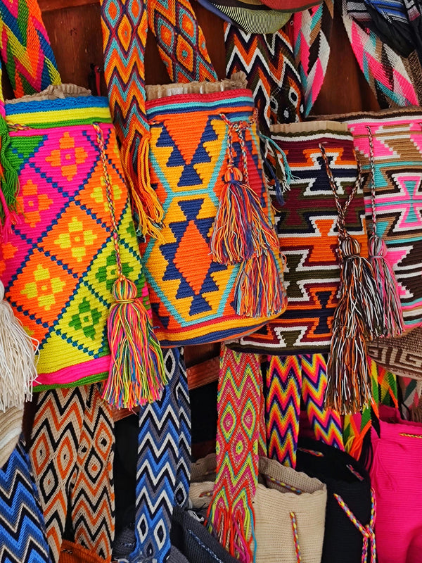 Vibrant handwoven bags showcasing the rich colors and patterns of traditional craftsmanship.